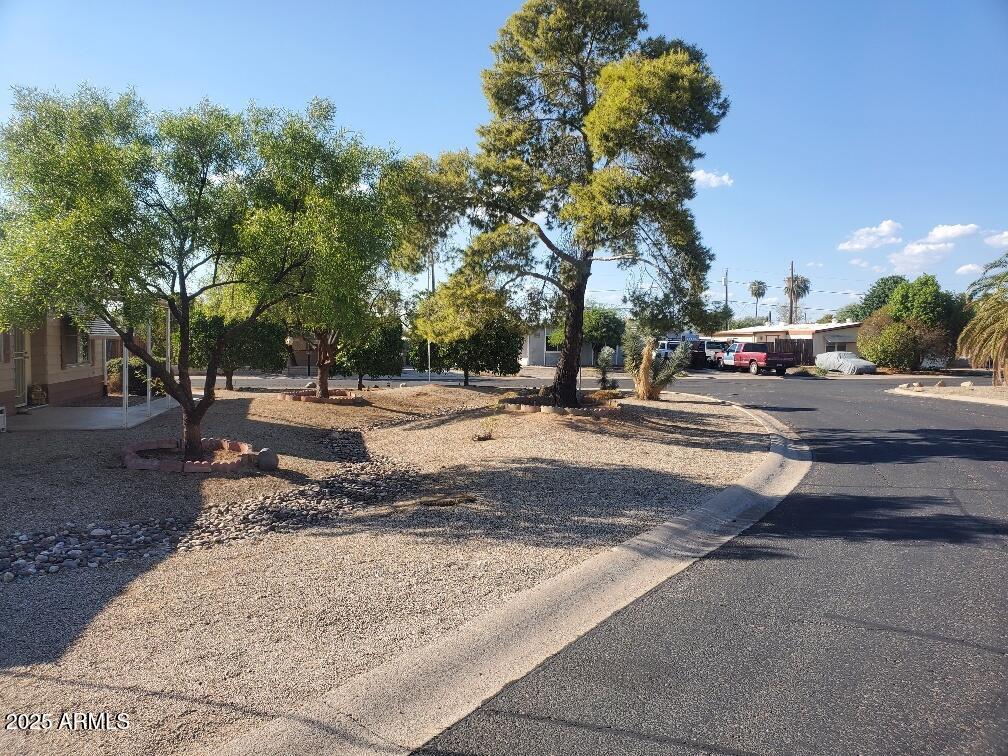 19065 North Dinero Road Sun City, AZ 85373 - Photo 8 of 37 a view of road with card parked on side and road