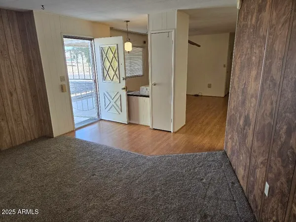 a view of hallway with wooden floor