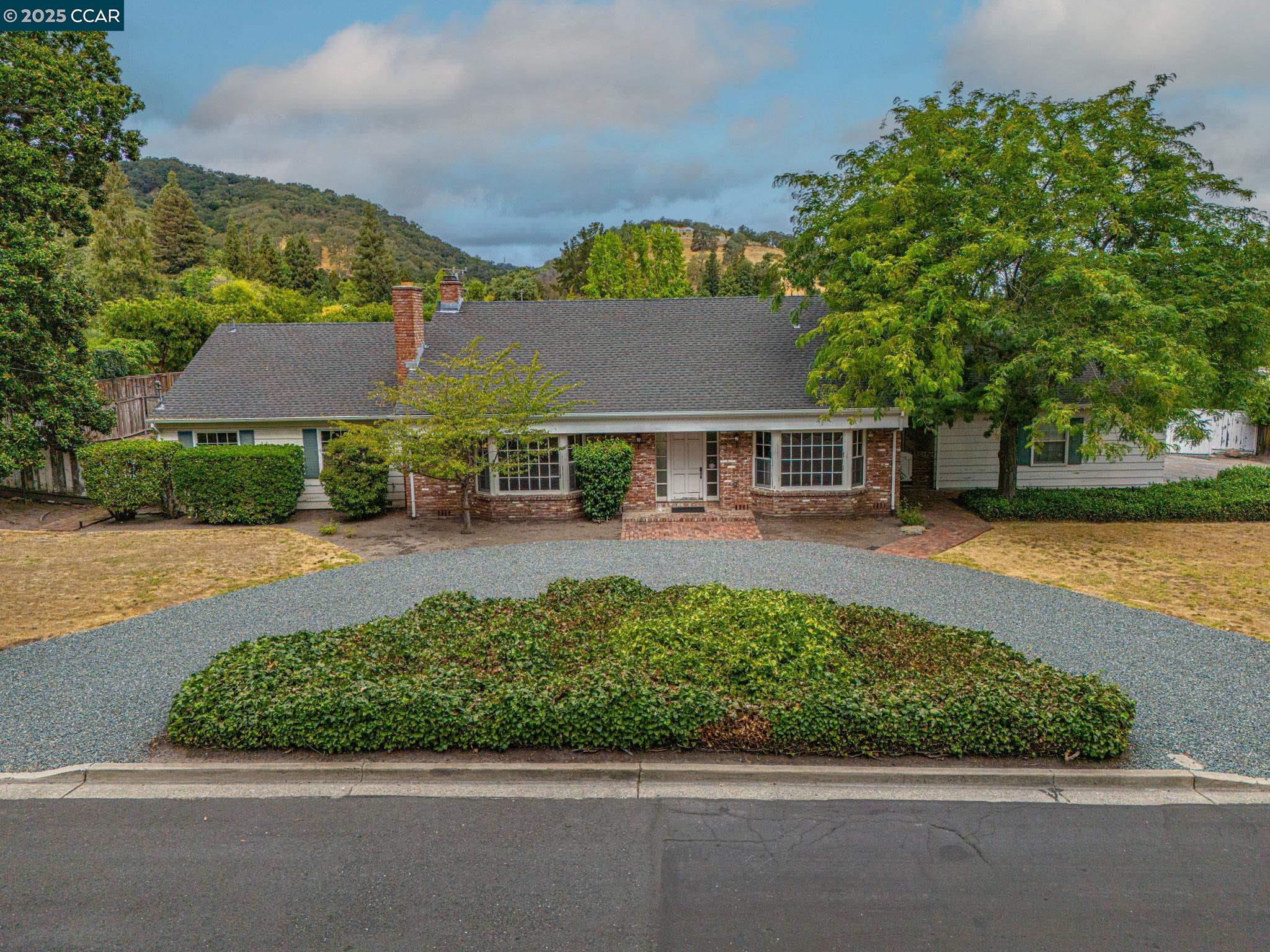 a front view of a house with a yard