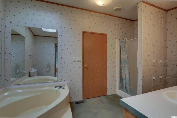 a bathroom with a bathtub and a sink