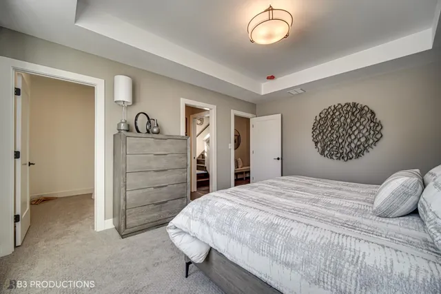 a bathroom with a double vanity sink toilet and shower