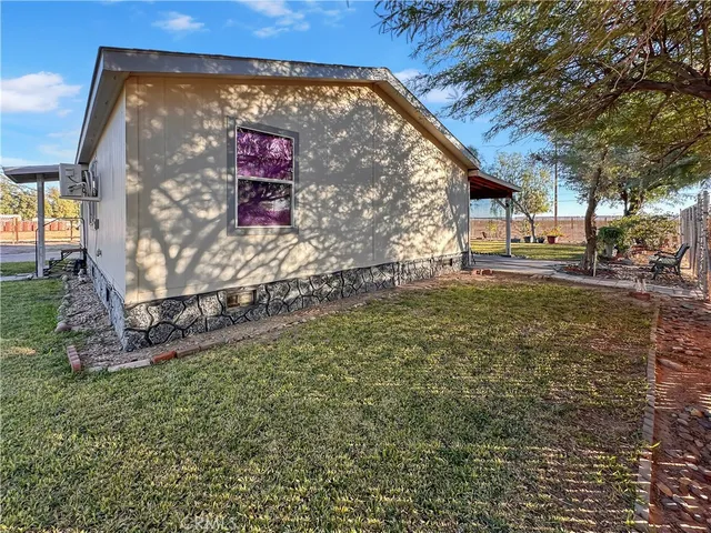 a sign board with a yard