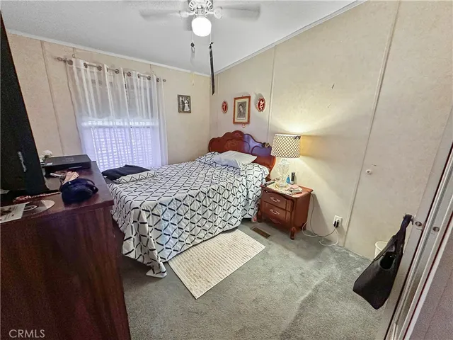 a bedroom with a bed and a walk in closet