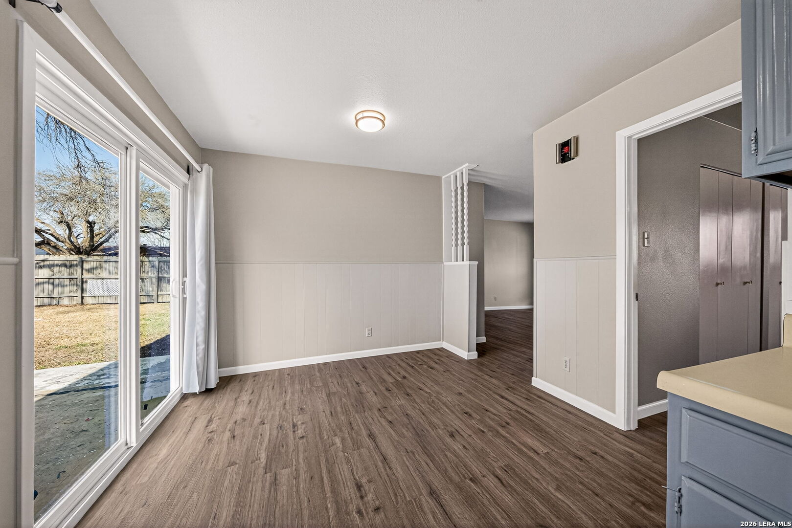 301 Deborah Drive Converse, TX 78109 - Photo 13 of 27 wooden floor in an empty room with a window
