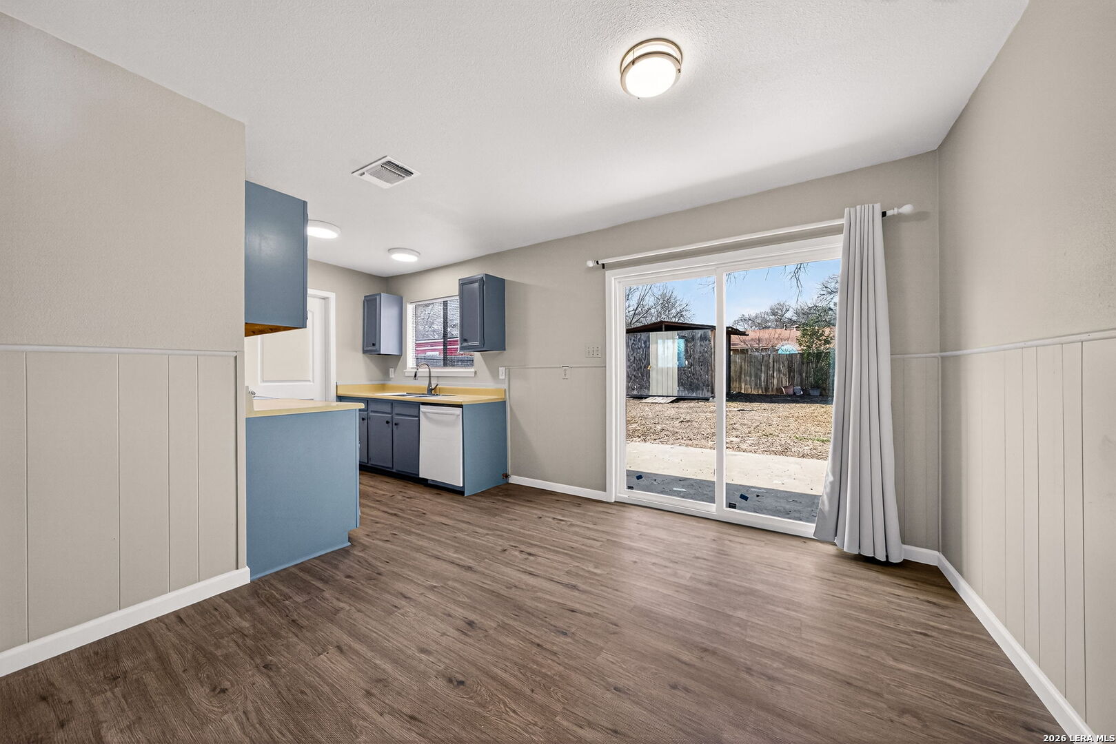 301 Deborah Drive Converse, TX 78109 - Photo 14 of 27 a view of a kitchen with wooden floor and electronic appliances