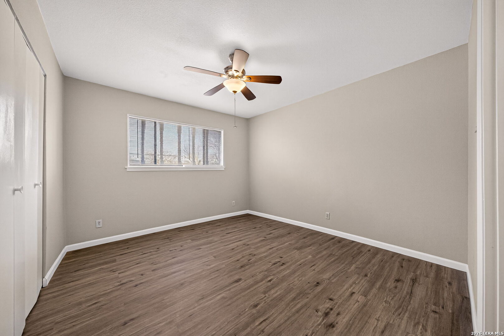 301 Deborah Drive Converse, TX 78109 - Photo 15 of 27 a view of empty room with wooden floor and fan