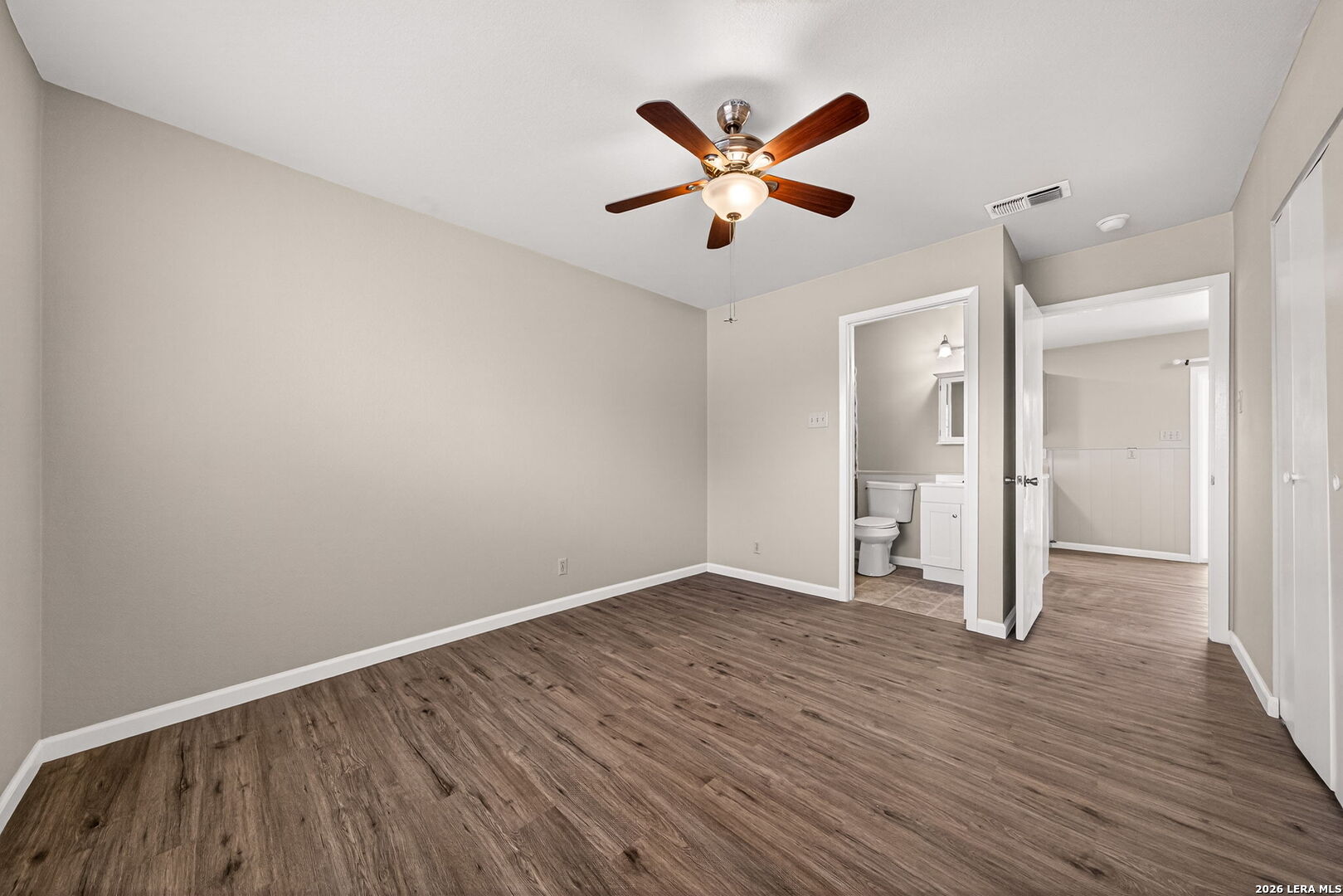 301 Deborah Drive Converse, TX 78109 - Photo 18 of 27 an empty room with wooden floor and mirror