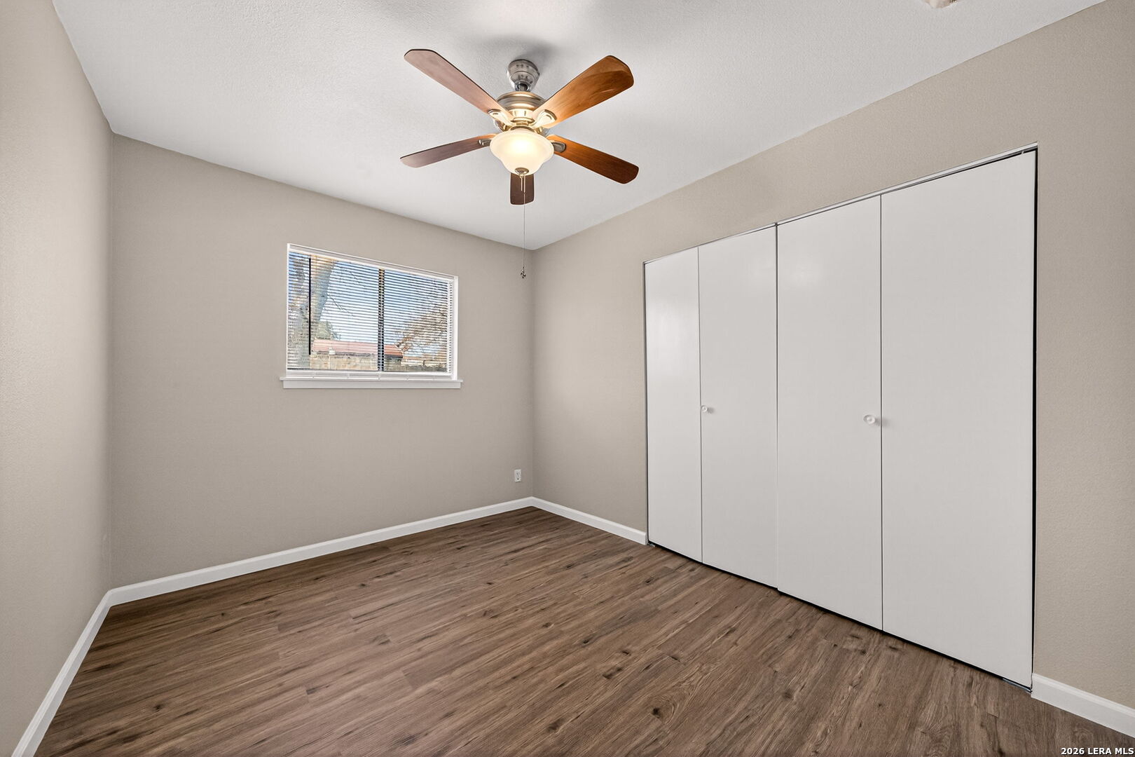301 Deborah Drive Converse, TX 78109 - Photo 19 of 27 an empty room with wooden floor and ceiling fan