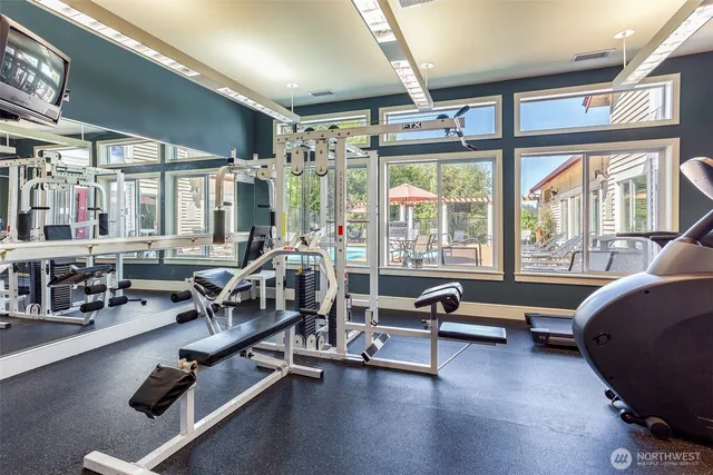 a view of a livingroom with hardwood floor and a large window