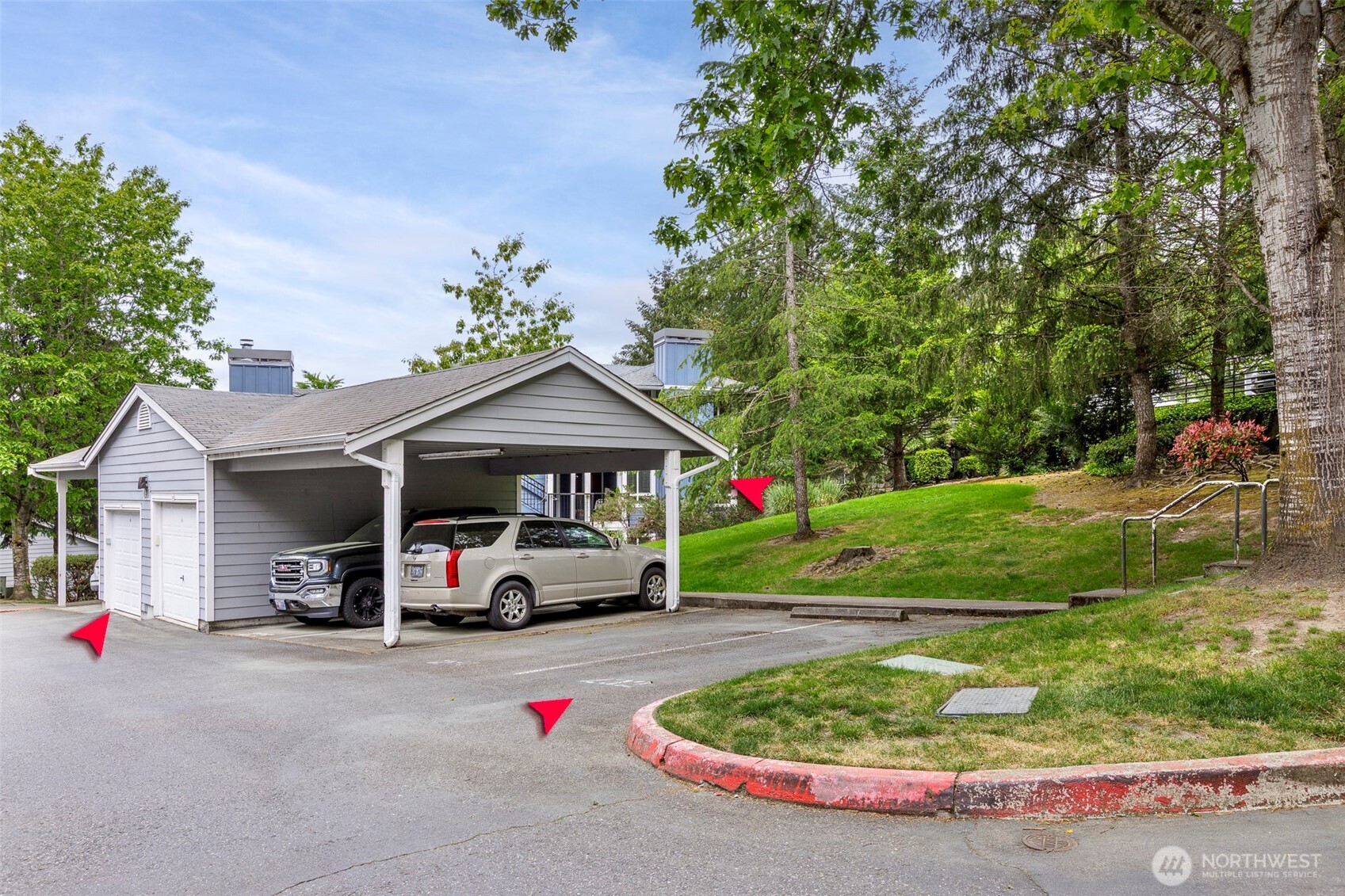 3915 243rd Place Southeast, Unit K204 Bothell, WA 98021 - Photo 22 of 23 a car parked in front of a house