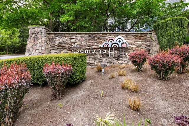 a sign that is in front of flowers