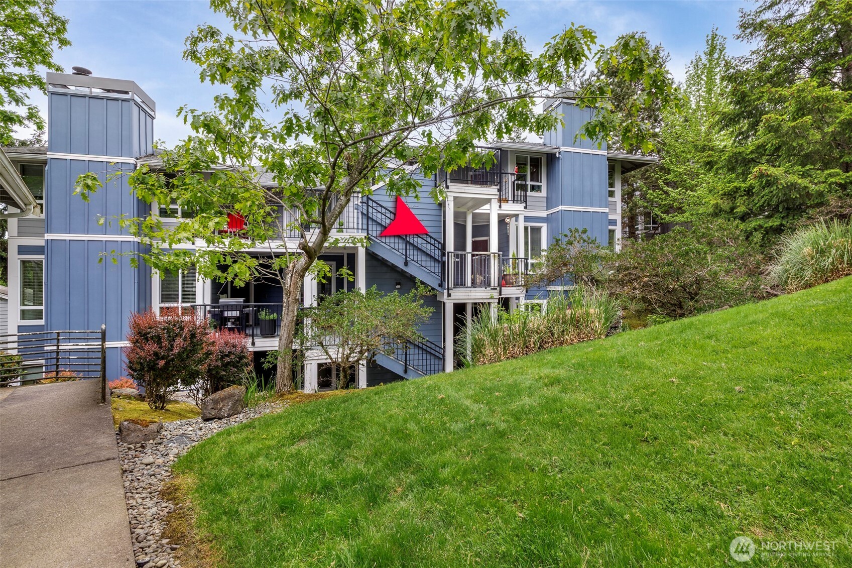 3915 243rd Place Southeast, Unit K204 Bothell, WA 98021 - Photo 3 of 23 a front view of house with yard and green space