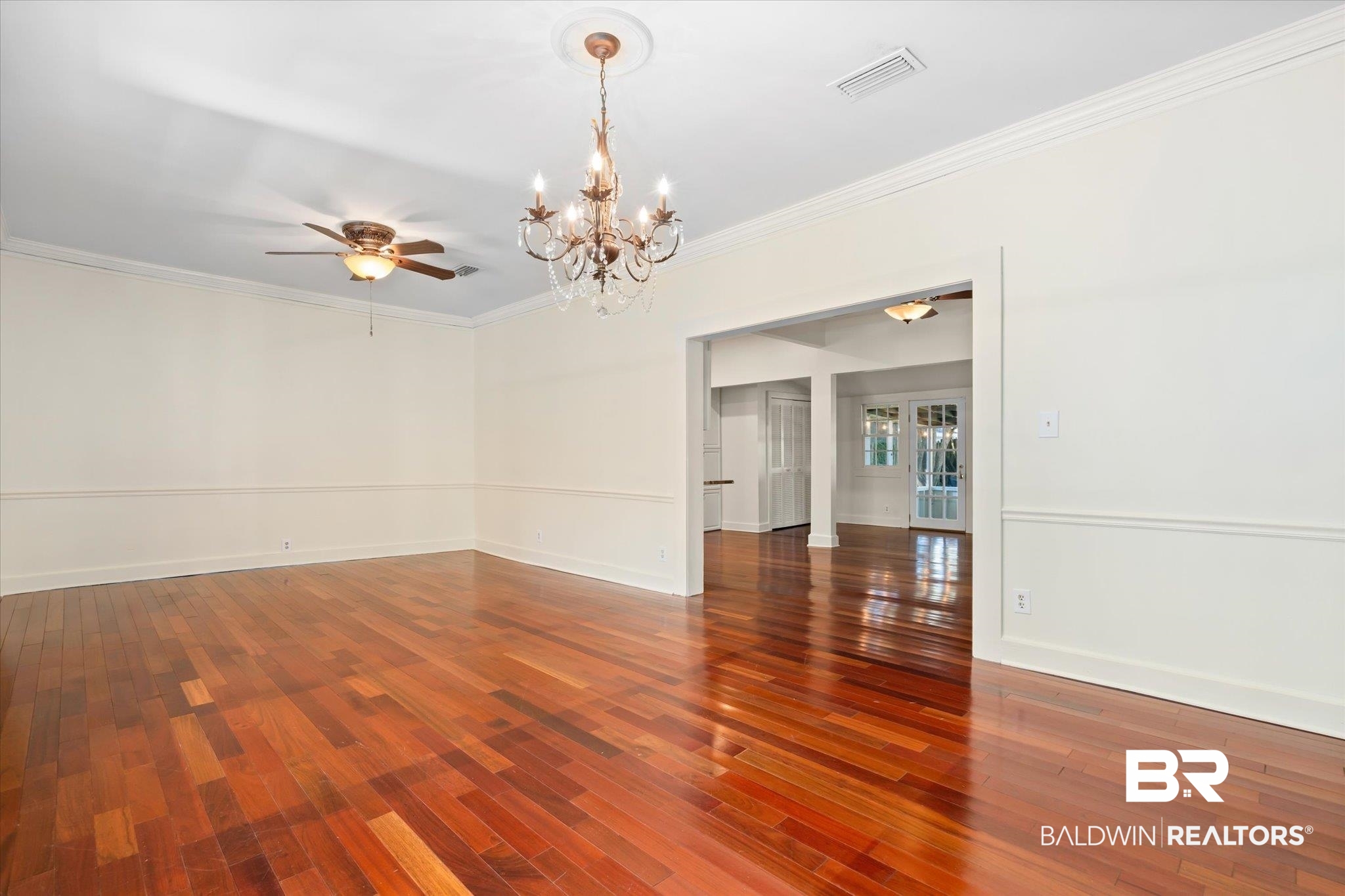 1220 Elmira Street Mobile, AL 36604 - Photo 4 of 20 Empty room featuring crown molding and hardwood / wood-style floors
