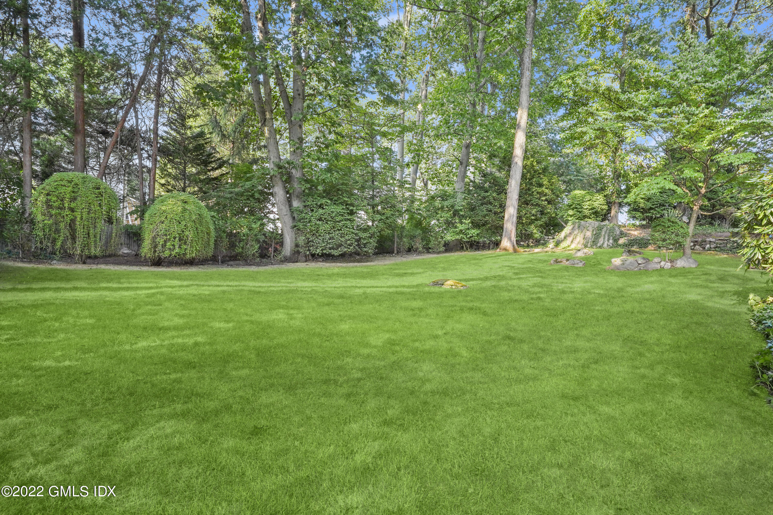 11 Wesskum Wood Road Riverside, CT 06878 - Photo 12 of 17 a view of a grassy field with trees in the background