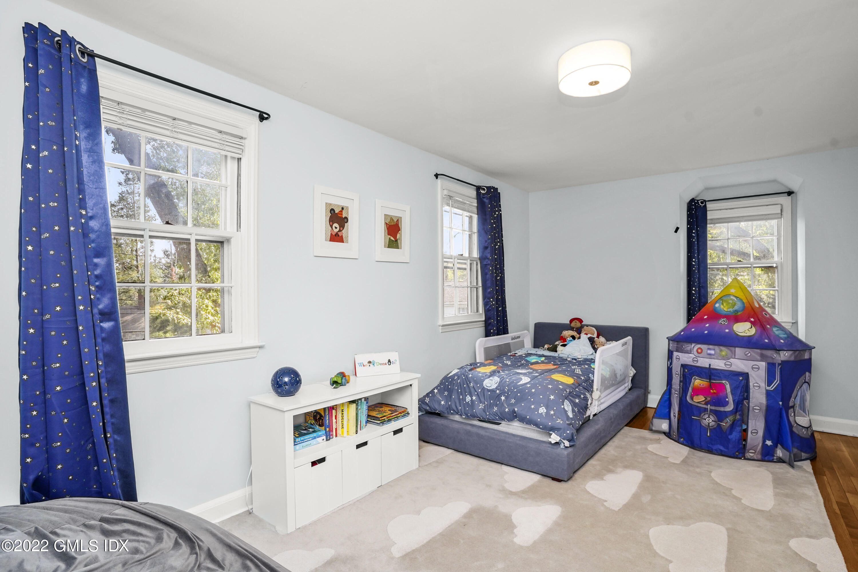 11 Wesskum Wood Road Riverside, CT 06878 - Photo 8 of 17 a living room with baby crib furniture and a window