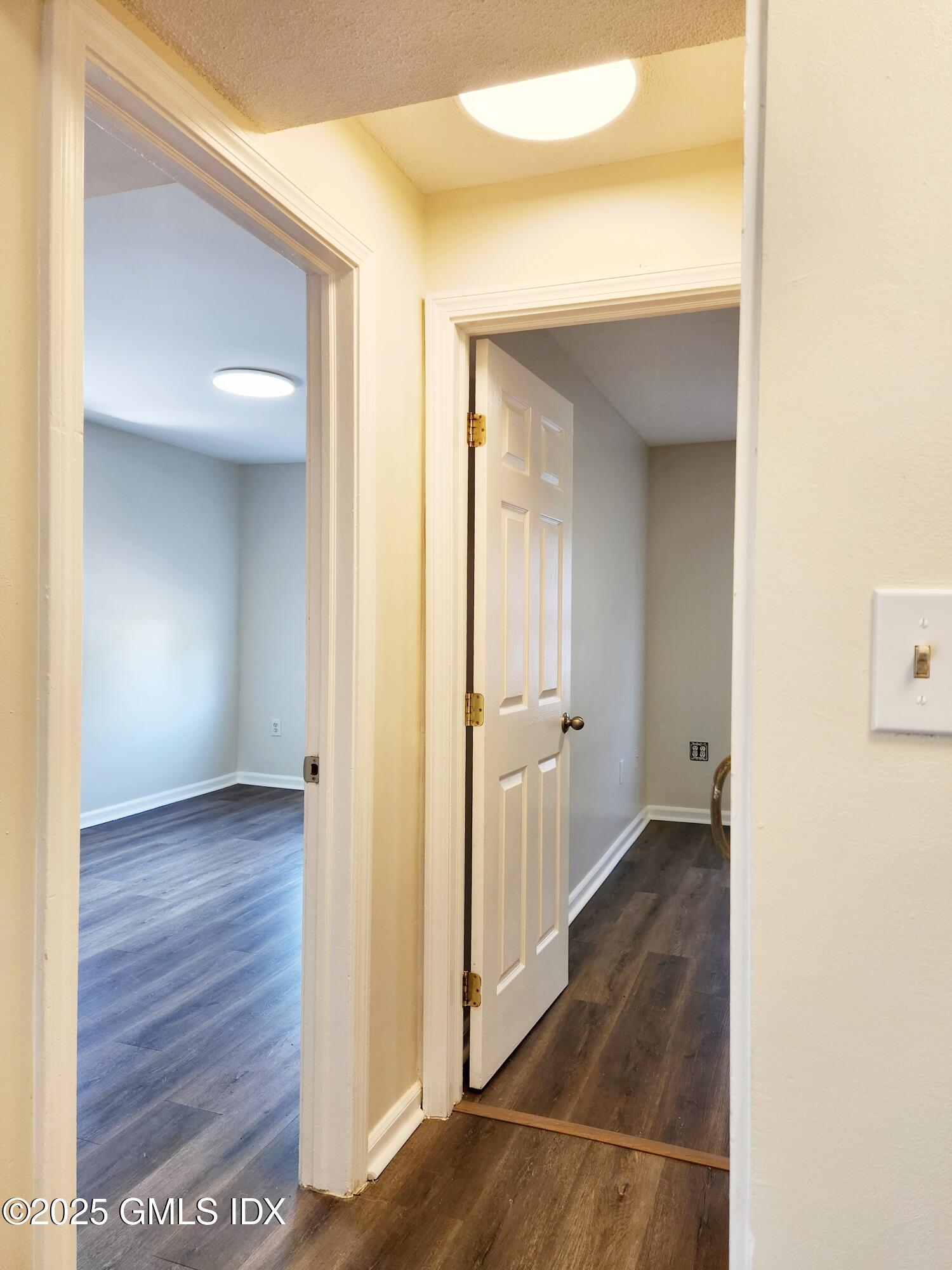 336 Hamilton Avenue, Unit B Greenwich, CT 06830 - Photo 12 of 16 a view of a hallway with wooden floor