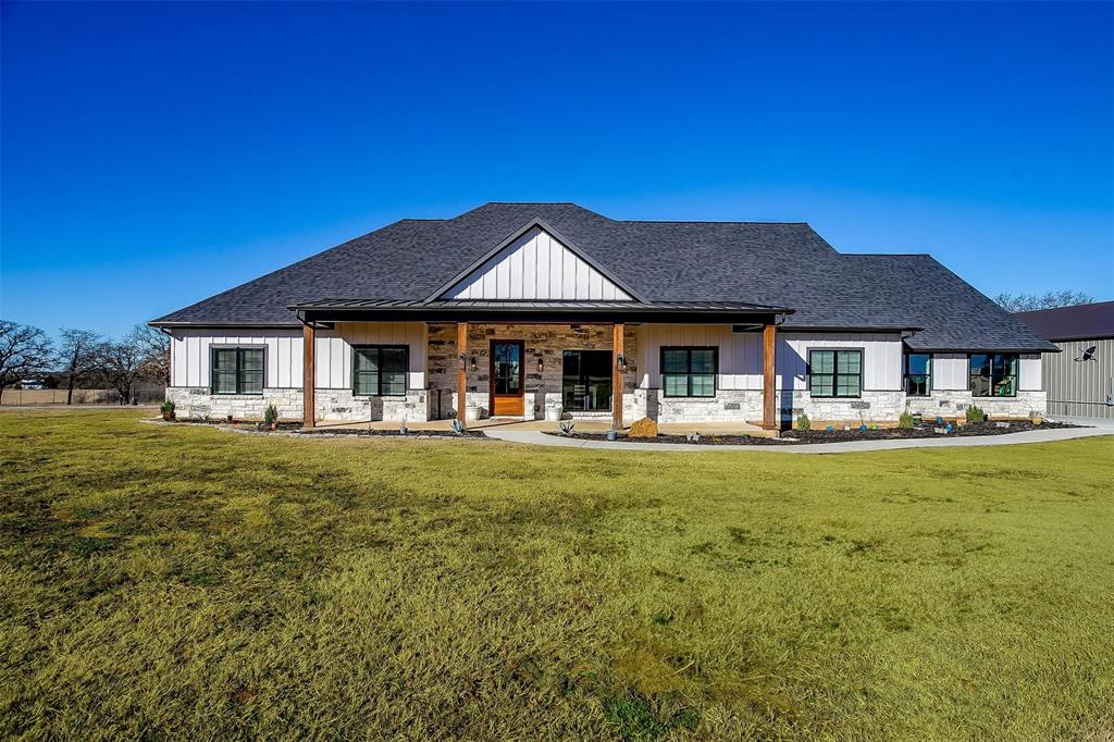 5621 County Road 803 Joshua, TX 76058 - Photo 1 of 40 a front view of a house with a garden