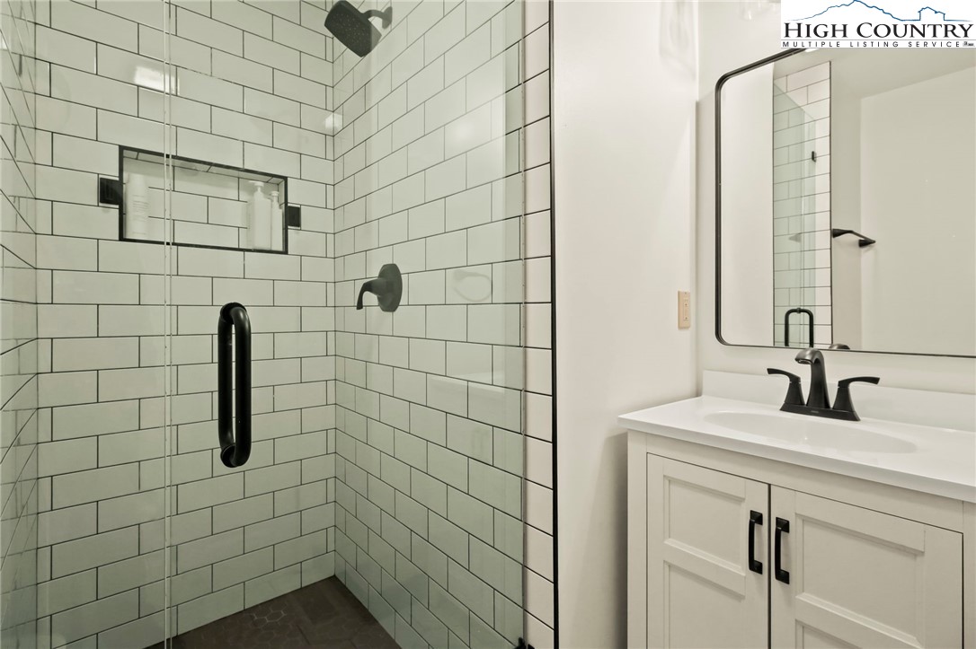 282 Charles Street Boone, NC 28607 - Photo 15 of 47 a bathroom with a shower