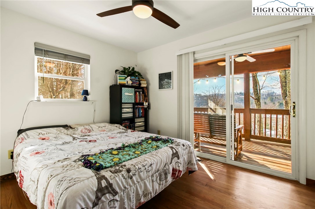 282 Charles Street Boone, NC 28607 - Photo 16 of 47 a bedroom with a large bed and a large window