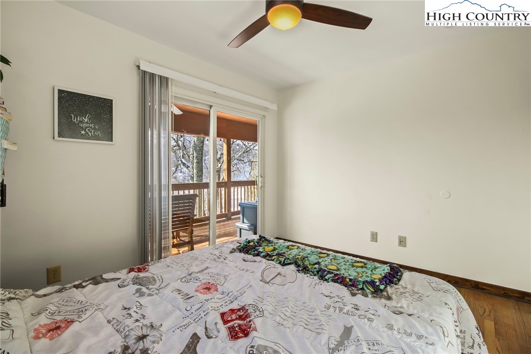 282 Charles Street Boone, NC 28607 - Photo 17 of 47 a bedroom with a bed and a window