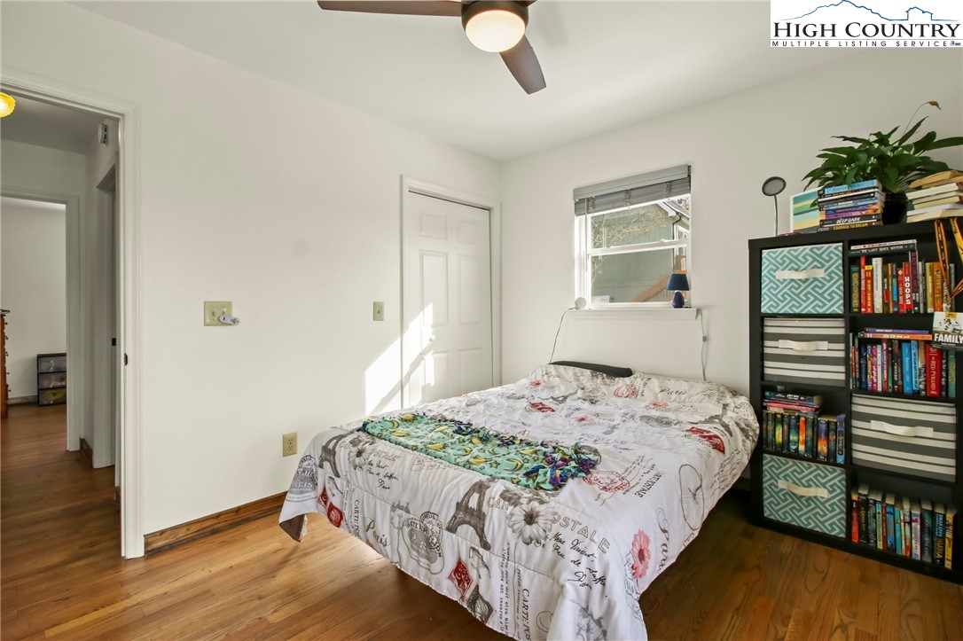 282 Charles Street Boone, NC 28607 - Photo 18 of 47 a bedroom with a bed and a book shelf