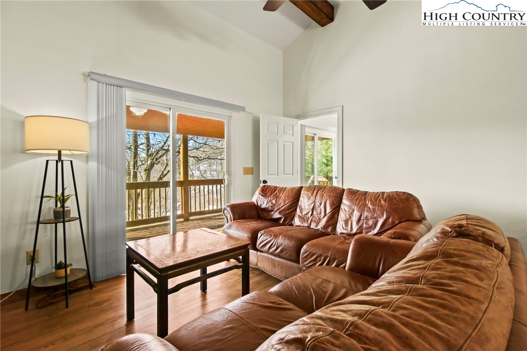 282 Charles Street Boone, NC 28607 - Photo 19 of 47 a living room with a couch and a wooden floor