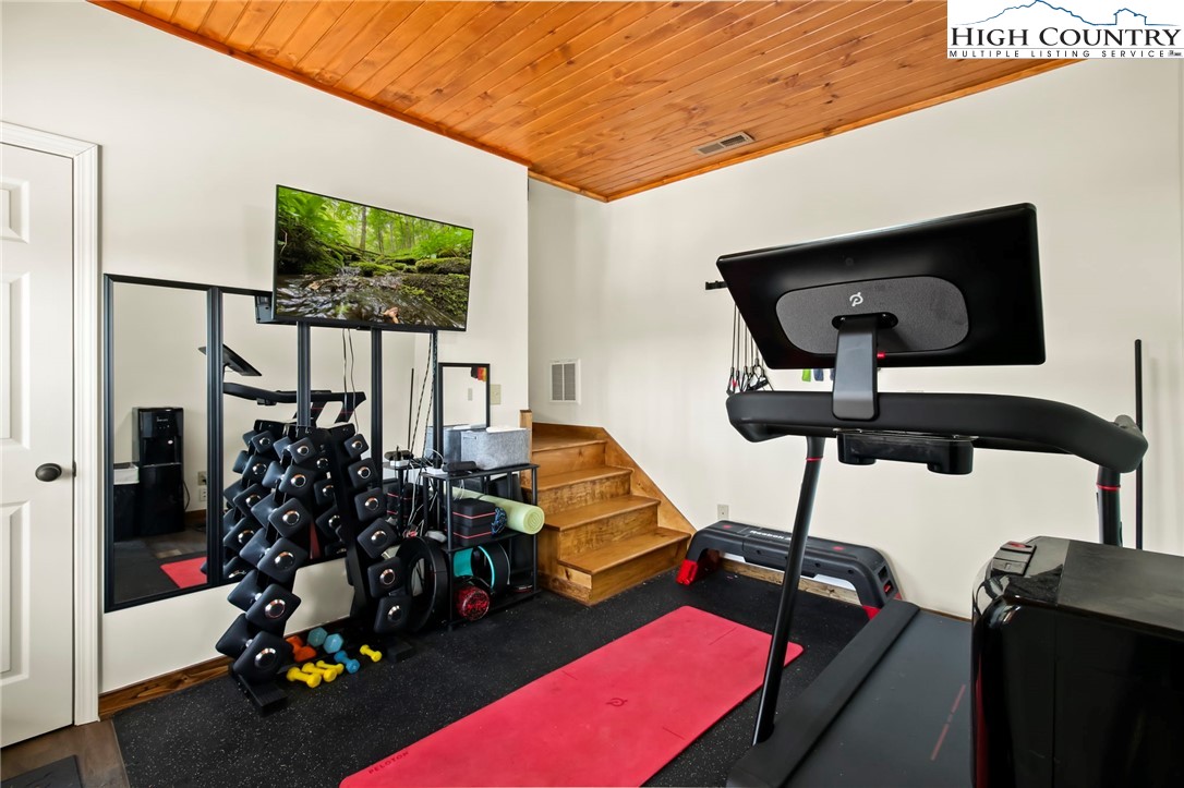 282 Charles Street Boone, NC 28607 - Photo 26 of 47 a living room with furniture and a flat screen tv