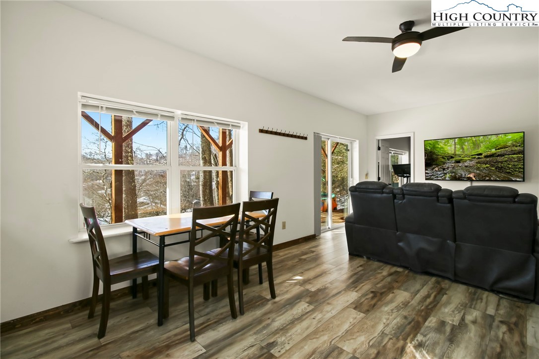 282 Charles Street Boone, NC 28607 - Photo 30 of 47 a view of a dining room with furniture window and wooden floor