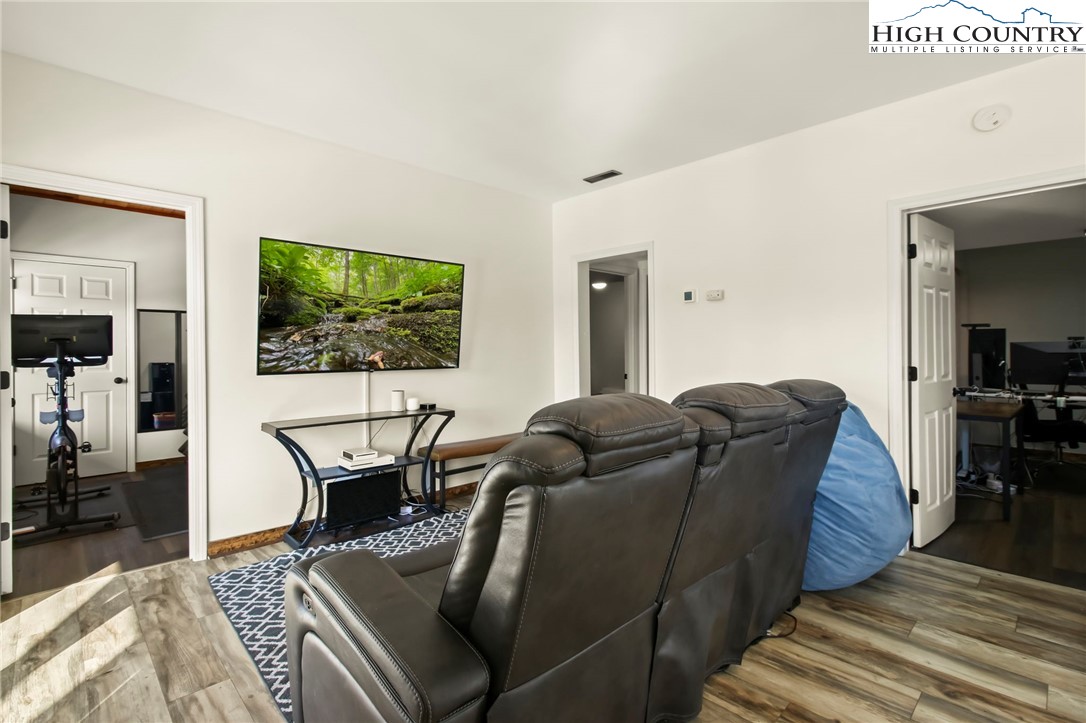 282 Charles Street Boone, NC 28607 - Photo 39 of 47 a living room with furniture and a flat screen tv