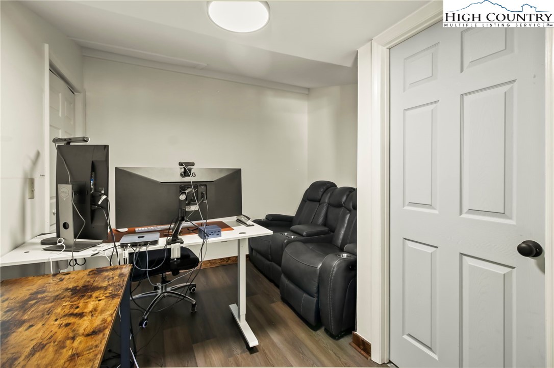 282 Charles Street Boone, NC 28607 - Photo 40 of 47 a view of workspace with wooden floor windows and lounge chair