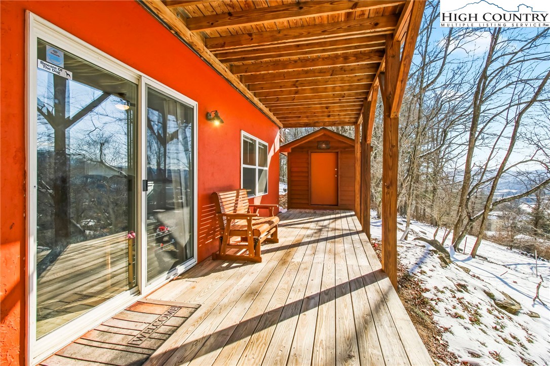 282 Charles Street Boone, NC 28607 - Photo 43 of 47 a view of balcony with a floor to ceiling window and wooden floor