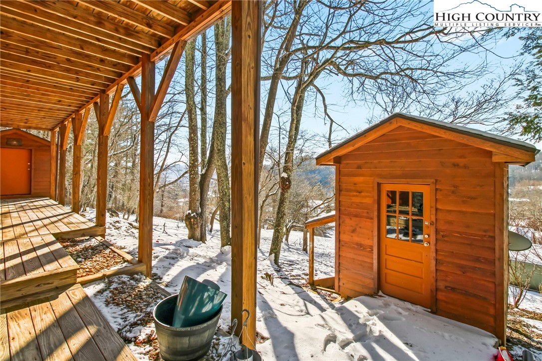 282 Charles Street Boone, NC 28607 - Photo 45 of 47 a backyard of a house with outdoor seating