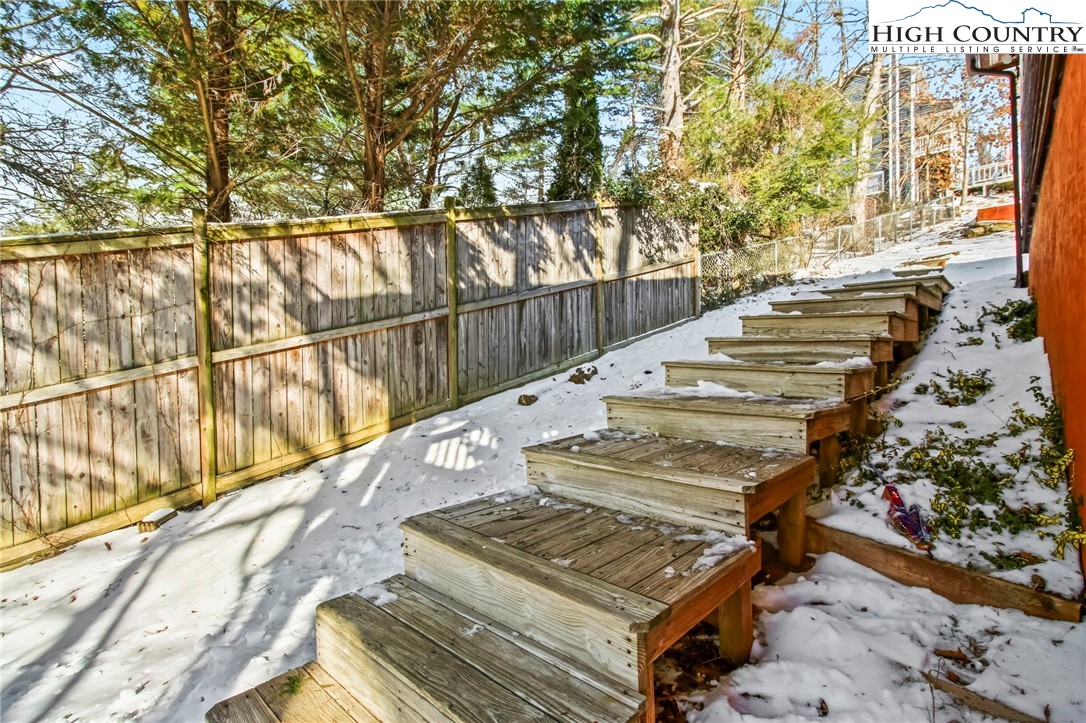 282 Charles Street Boone, NC 28607 - Photo 46 of 47 a view of a balcony with wooden floor and fence
