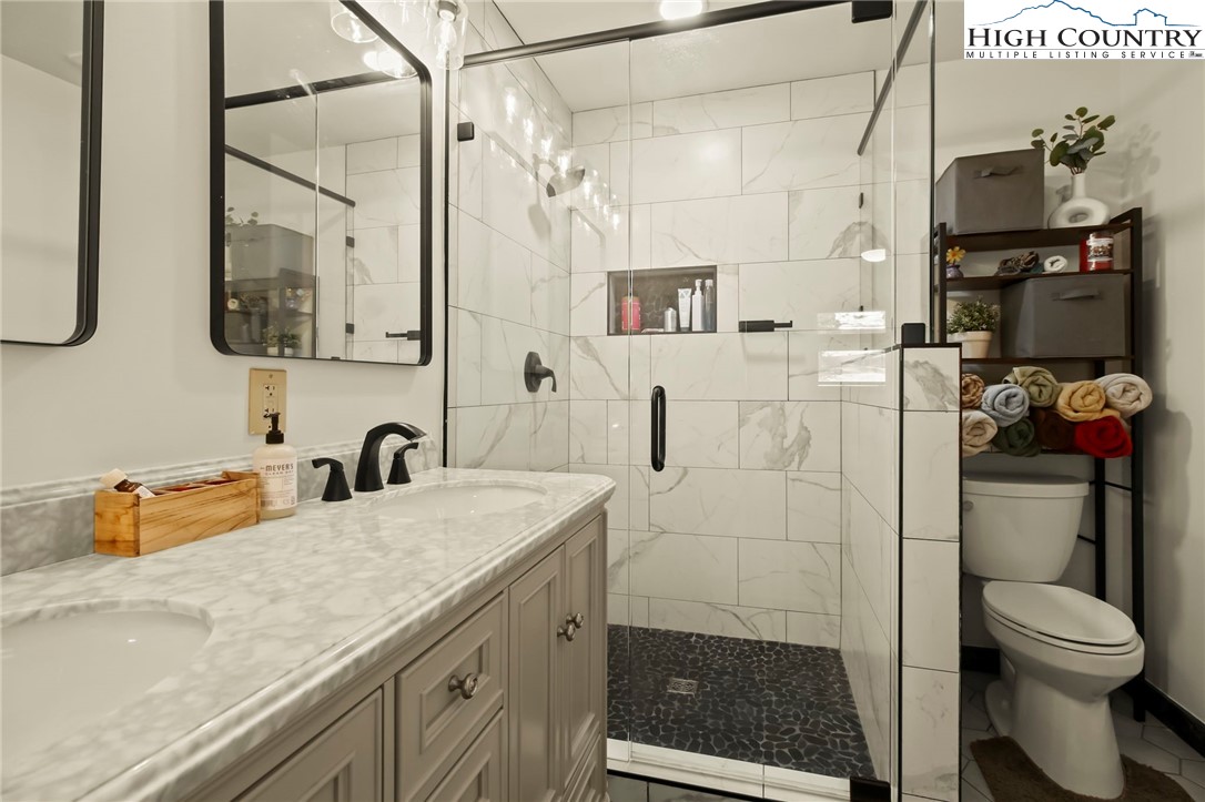 282 Charles Street Boone, NC 28607 - Photo 7 of 47 a bathroom with a sink toilet and shower