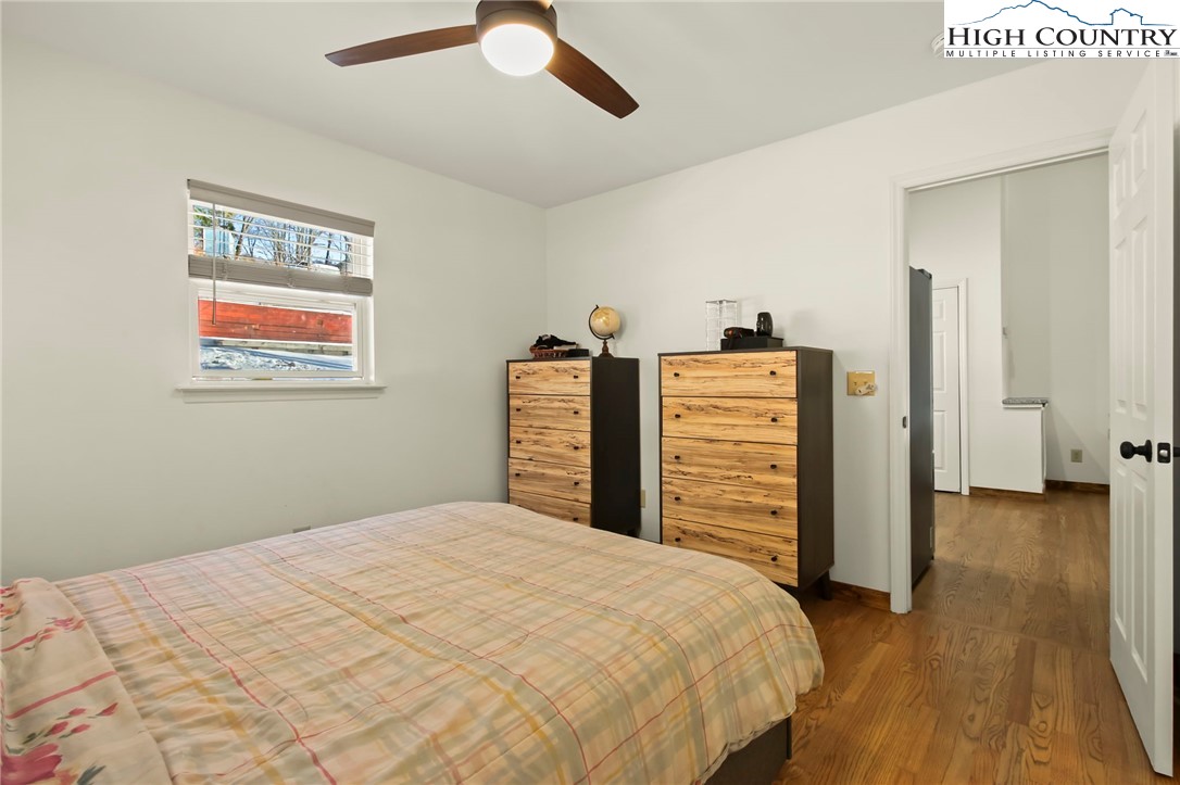 282 Charles Street Boone, NC 28607 - Photo 9 of 47 a bedroom with a bed and a television