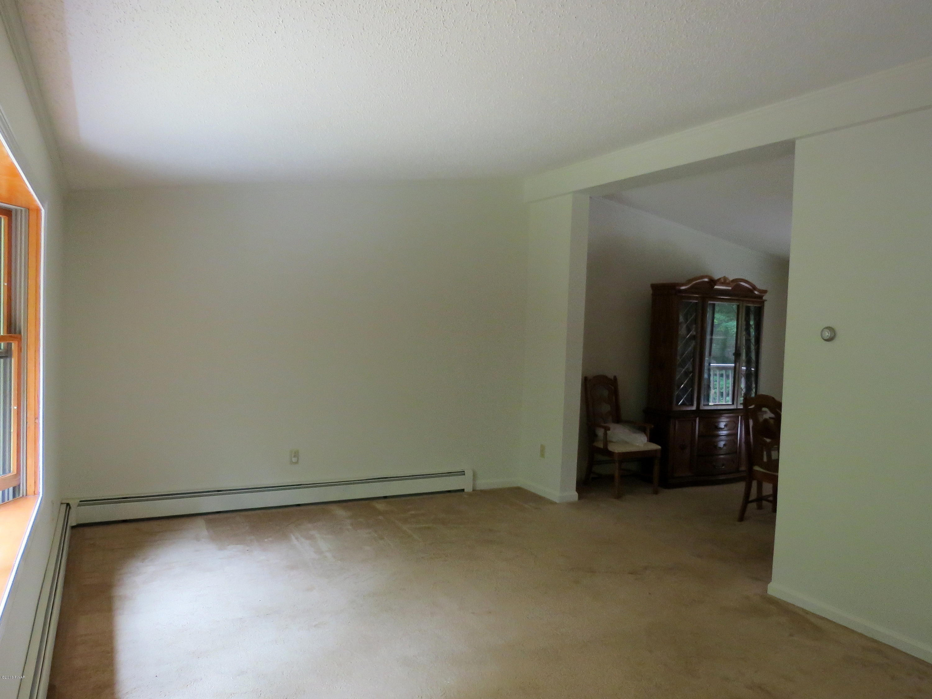124 Pine Road Hawley, PA 18428 - Photo 3 of 46 Living room to dining room