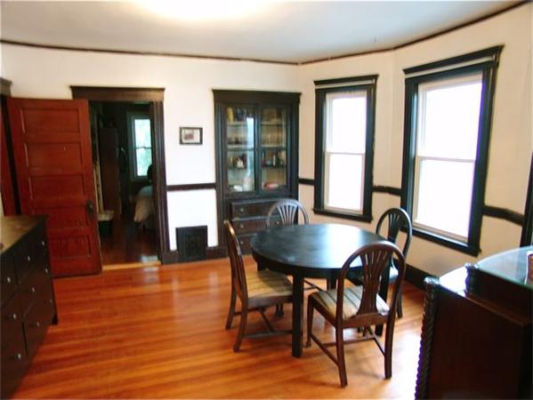 31 Torrey Street Boston, MA 02124 - Photo 3 of 11 a view of a dining room with furniture and wooden floor