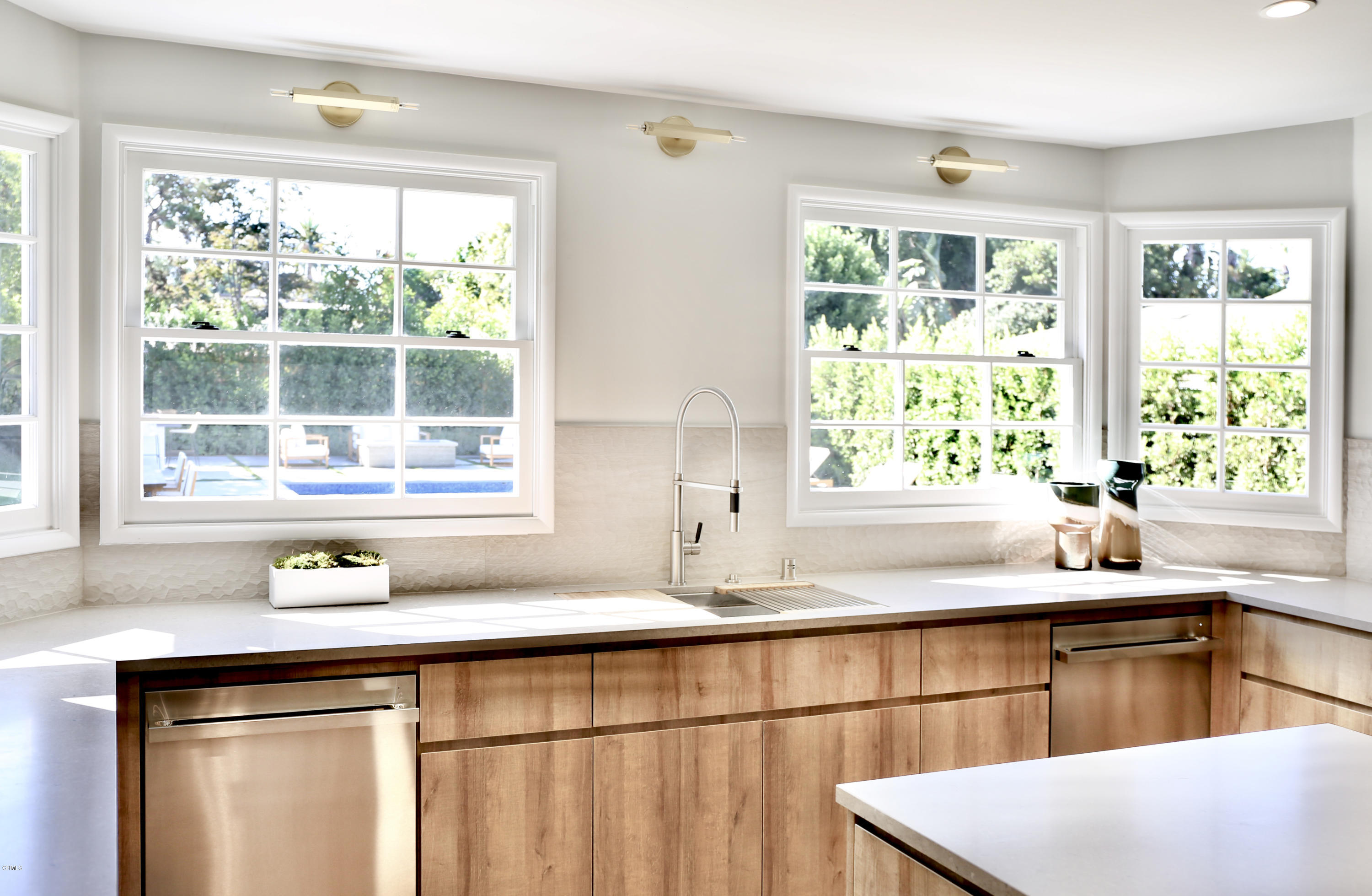 300 Wigmore Drive Pasadena, CA 91105 - Photo 19 of 59 a kitchen with stainless steel appliances cabinets and a large window