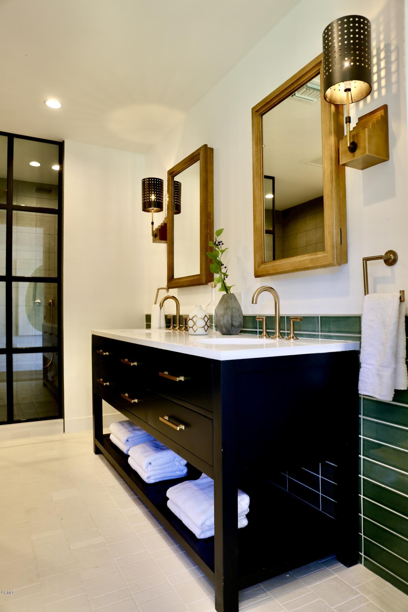 300 Wigmore Drive Pasadena, CA 91105 - Photo 43 of 59 a bathroom with a sink and a mirror