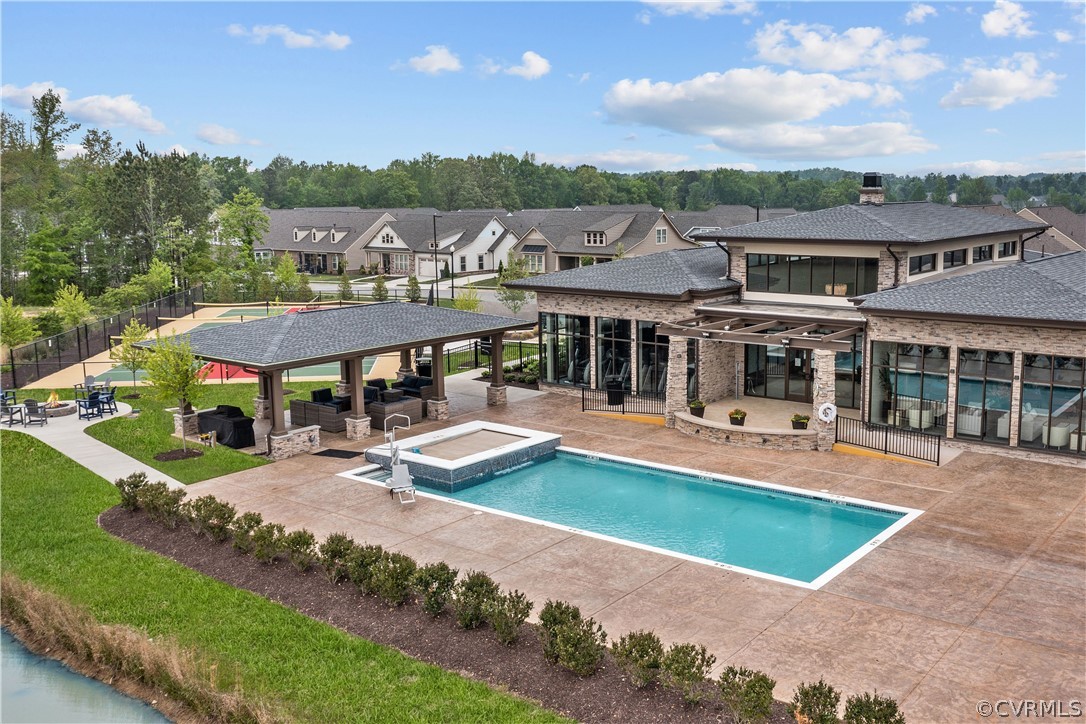 6601 Citory Way, Unit 305 Moseley, VA 23120 - Photo 17 of 23 an aerial view of a house with swimming pool and a yard
