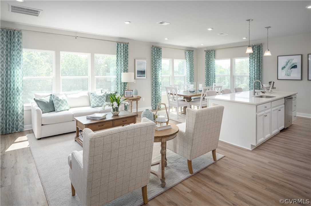 6601 Citory Way, Unit 305 Moseley, VA 23120 - Photo 2 of 23 a view of a dining room with furniture and wooden floor