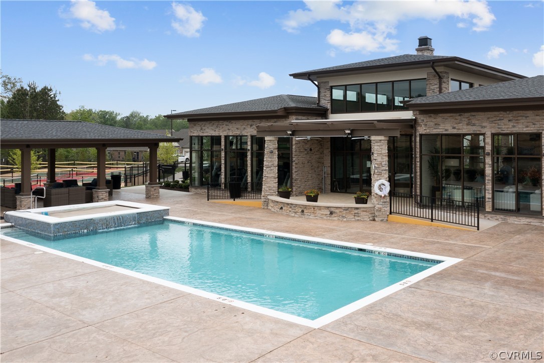 6601 Citory Way, Unit 305 Moseley, VA 23120 - Photo 21 of 23 a view of a house and a swimming pool
