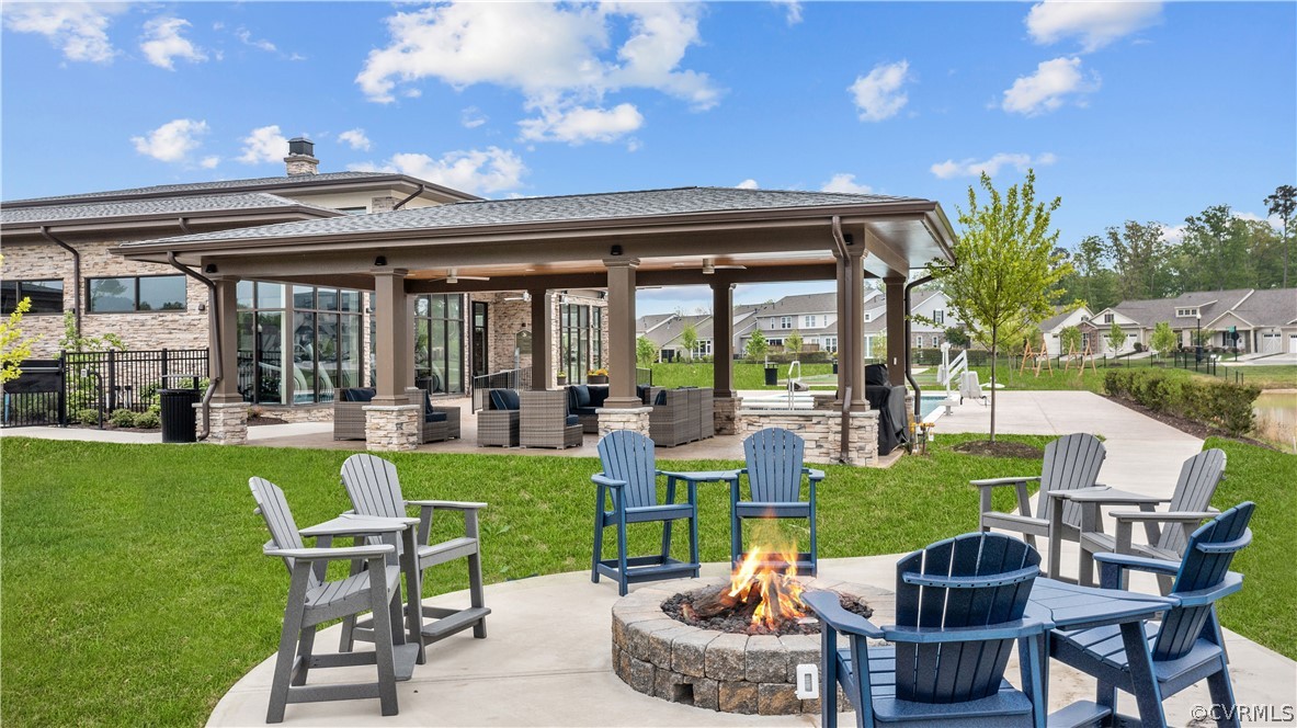 6601 Citory Way, Unit 305 Moseley, VA 23120 - Photo 22 of 23 a view of an chairs and table in patio with a yard