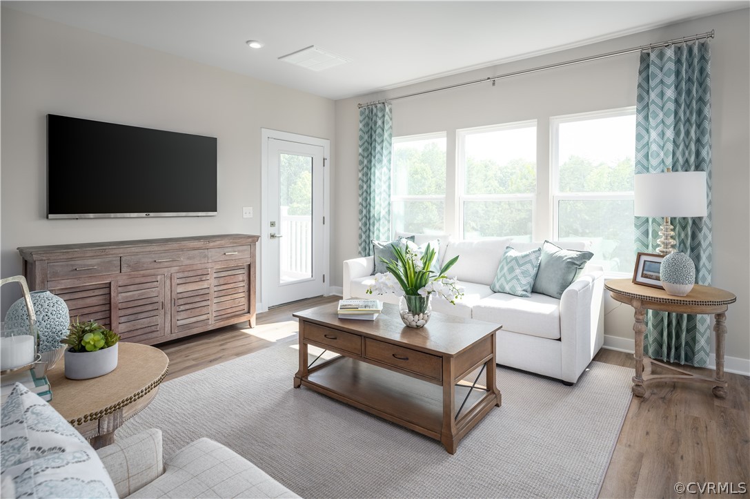 6601 Citory Way, Unit 305 Moseley, VA 23120 - Photo 5 of 23 a living room with furniture floor and a flat screen tv