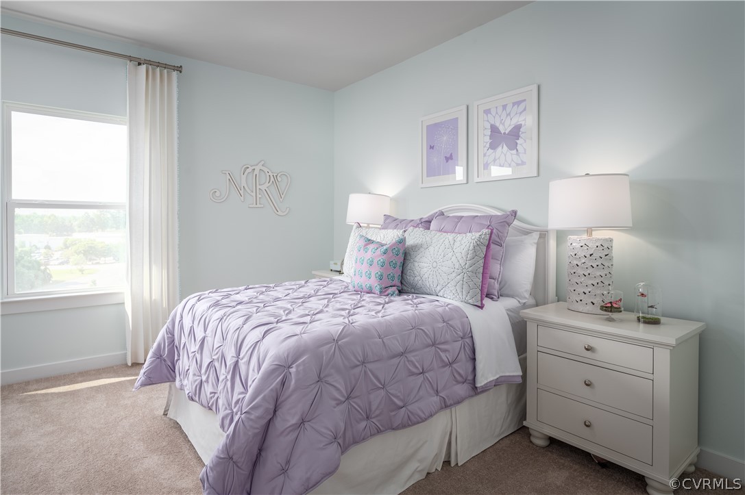 6601 Citory Way, Unit 305 Moseley, VA 23120 - Photo 6 of 23 a bedroom with a bed and a window