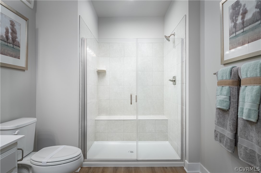 6601 Citory Way, Unit 305 Moseley, VA 23120 - Photo 7 of 23 a bathroom with a toilet and a shower