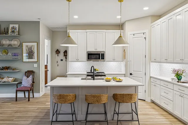 a kitchen with a sink cabinets and window
