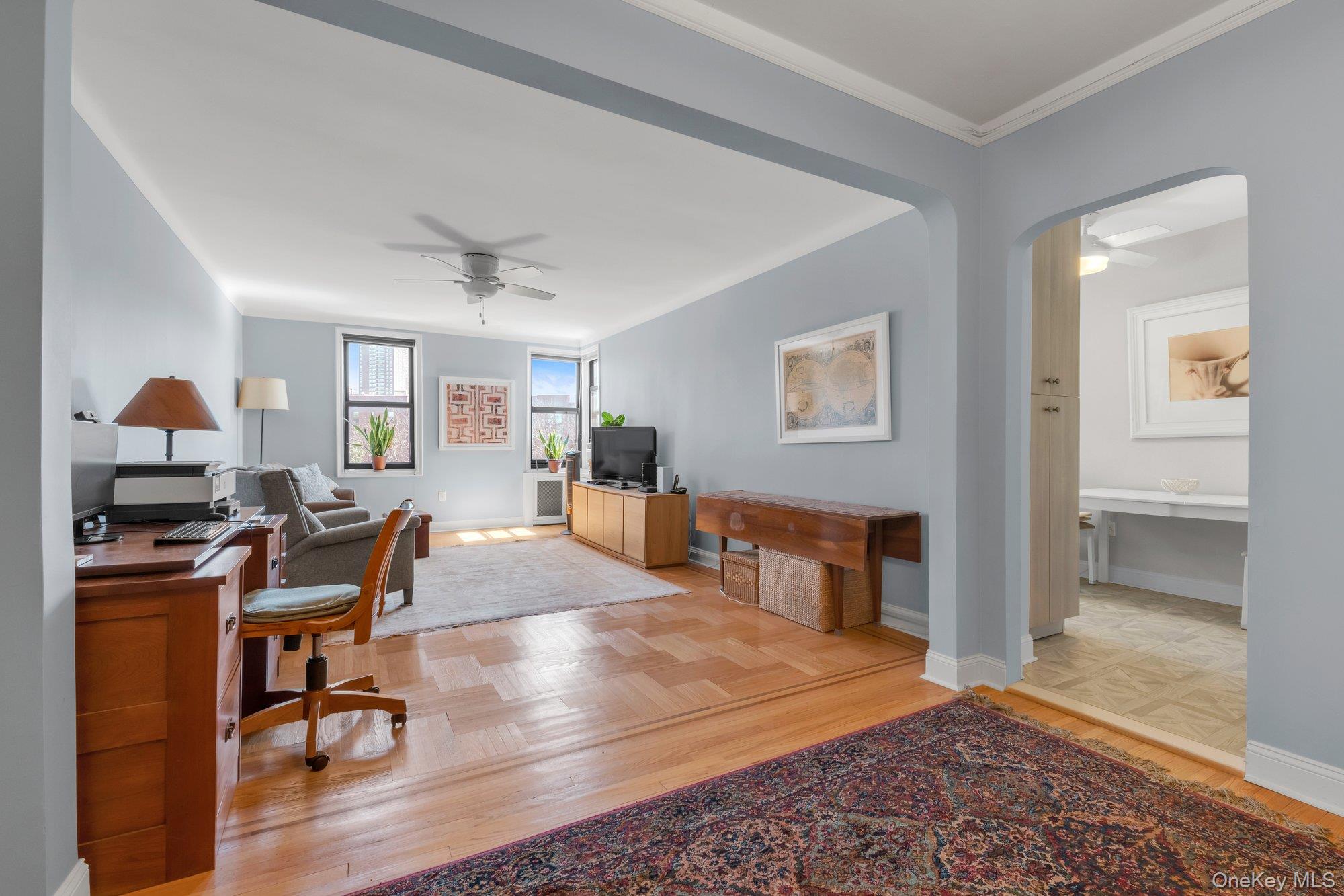 84-51 Beverly Road, Unit 6A Queens, NY 11415 - Photo 3 of 14 a view of a livingroom with furniture and a workspace