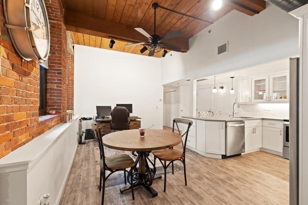 50 Rantoul Street, Unit 110 Beverly, MA 01915 - Photo 17 of 37 a view of a dining room with furniture window and wooden floor