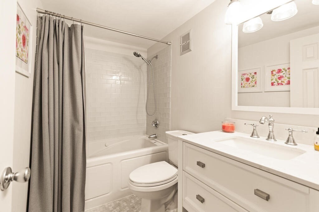 50 Rantoul Street, Unit 110 Beverly, MA 01915 - Photo 26 of 37 a bathroom with a sink toilet and shower